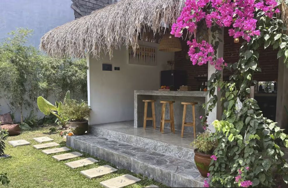 Open kitchen and bar overlooking Rumah Jambu's flowering garden